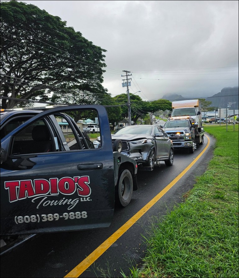 Flatbed tow truck loading a vehicle
